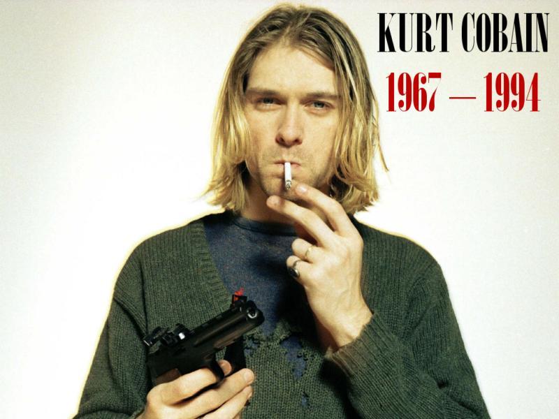 Kurt Cobain s cigaretou v puse a se zbraní v ruce