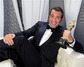 Jean Dujardin se soškou Oskara v ruce a širokým úsměvem