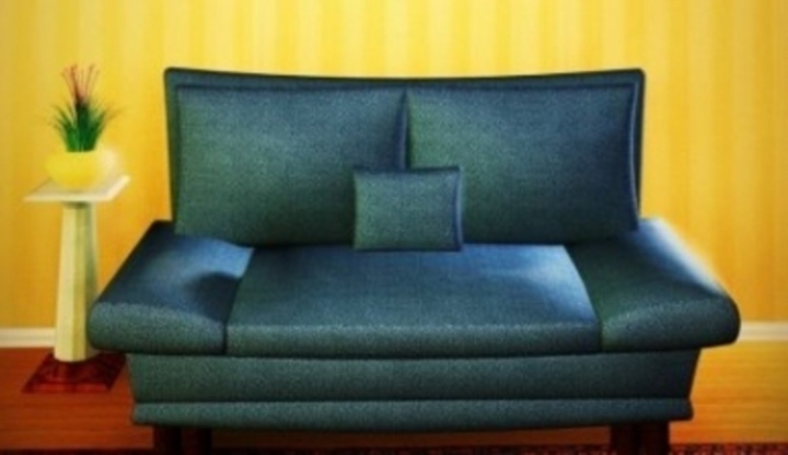 Jak si najít ideální bydlení? Detailní záběr na sedačku umístěnou v pokoji