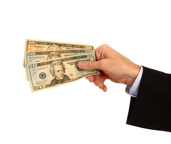 Dobeš srovná všechny Fotografie pánské ruky, která drží americké bankovky v ruce