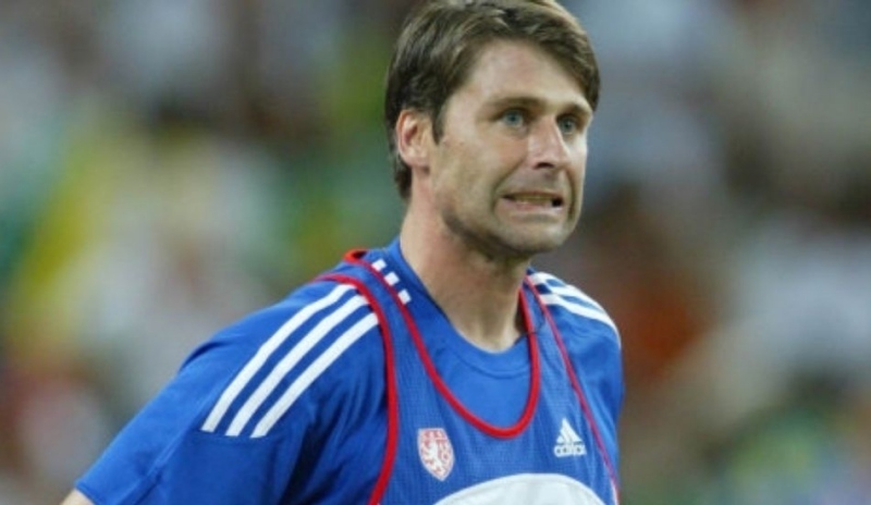 Fotografie Jana Železného,který grimasou dotahuje svůj hod