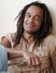 Yannick Noah bývalý profesionální tenista s úsměvem na tváři
